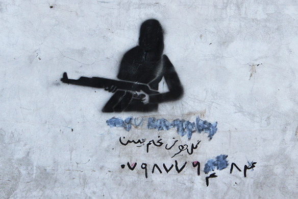 Graffiti in Kabul's streets—lady with an ak47.