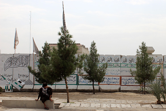 Just another street in Kandahar, Taliban's spiritual capital and headquarters, with Taliban propaganda on the blast walls.