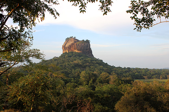 UNESCO-listed Sigiriya Rock Fortress is built on three levels: a landscaped water and boulder garden at the base; the Sigiriya frescoes and Lion's Paws entrance halfway up the exposed monolith; and a palace, replete with gardens, pond, and throne on the summit.