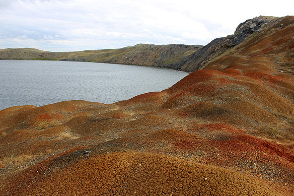 Walking along the lunar-like Atomic Lake on a two-hour hike over a 38-metre-high caldera flung out of the bowels of the earth. Except that this was no natural phenomenon.
