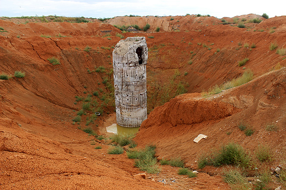 Underground laboratory to test subterranean explosions. The scalloped hollow around the monumental concrete edifice was created by looters looking for treasures. Nope, there was no gold to be found for all the effort! But instead, they did get their hands on lots of copper wires.