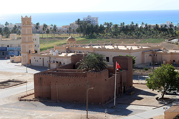 Taqah Castle and Afif Mosque as seen from Burj Al-Askar, with Taqah Beach in the background.