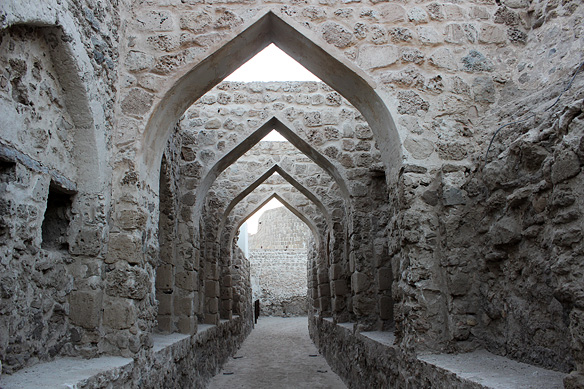 Grand archways inside Qal'at Al-Bahrain. The fort was built by the Portuguese who ruled Bahrain from 1521 to 1602.