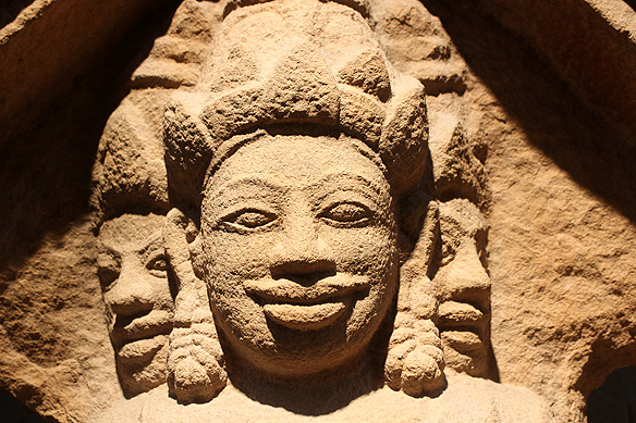 Brahma's four heads [one hidden behind] looking out at the four directions of the universe, 12th – 13th Century, Sandstone, Phu Hung.