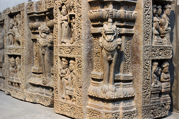 Altar pedestal with scenes from Buddha's life and large standing lions, 9th Century, Sandstone, Dong Duong Buddhist Complex.