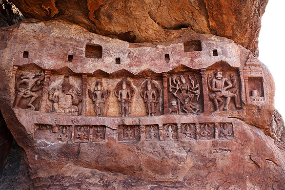 Frieze with multiple deities on a massive boulder near the Bhoothnath temple complex.