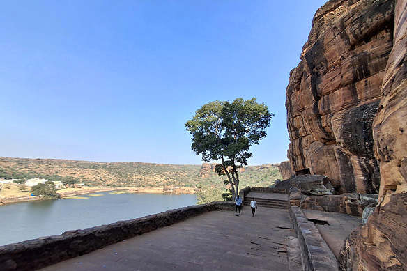In the forecourt of Cave 4. To the left, down below, is the sacred 7th Century lake Agastya Teerth.