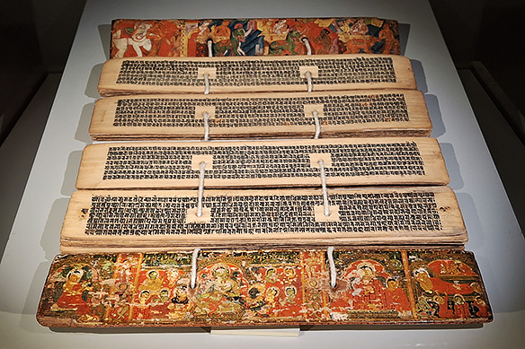 Ashtasahasrika Prajnaparamita Sutra is a 297-folio text transcribed by Vajracharya Bandhugupta. It features Buddha's life on the front cover and the Vessantara Jataka on the rear cover. 1350 CE, Eastern India.