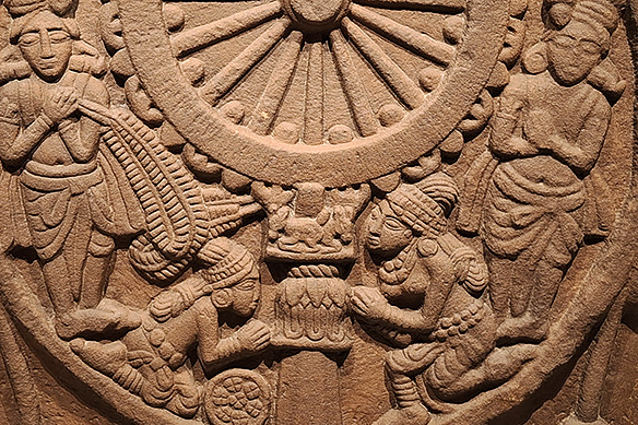Red sandstone relief showing devotees reverently worship the Dharma Chakra, symbol of Buddha's teaching. 2nd Century BCE, Bharhut, Madhya Pradesh.