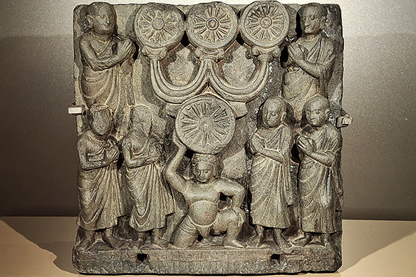 Kushana Gandhara relief depicting devotees venerating the sacred Tri-ratna which represents the three Buddhist 'jewels': Buddha, Dharma [teachings], and Sangha [community]. 2nd Century CE, Lower Monastery at Nathu [North-West part of Undivided India].