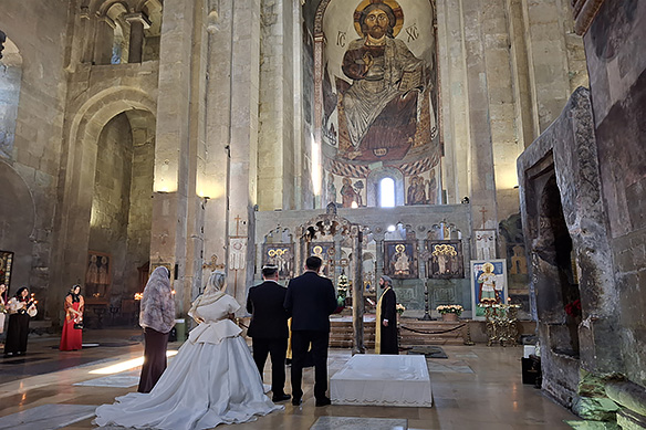 A wedding in full swing at the grand early-11th Century UNESCO-listed Svetitskhoveli Cathedral in Mtskheta.